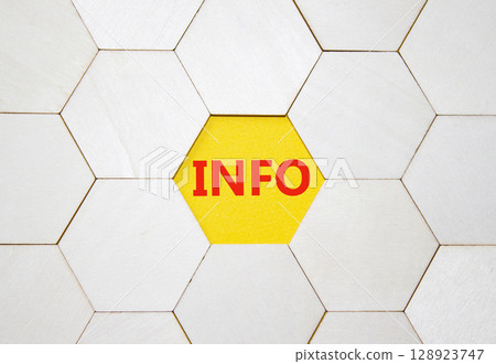Info symbol. Concept word Info on wooden comb puzzle. Beautiful yellow background. Business and Info concept. Copy space. 128923747