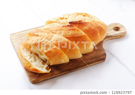 Baguette - Freshly baked delicious French bread Baguette - Freshly baked delicious French bread 128923797