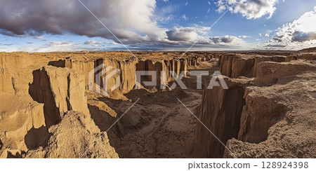 Dramatic Desert Canyon Landscape Breathtaking Sand Formations Golden Hour sun sky arid rock view Dramatic Desert Canyon Landscape Breathtaking Sand Formations Golden Hour sun sky arid rock view 128924398