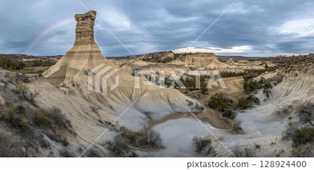 Dramatic Desert Landscape Majestic Rock Formation Unique Canyon Rainbow Sky Nature arid pale view 128924400