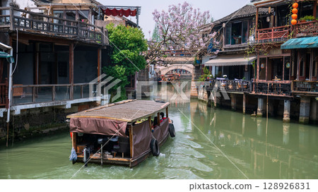 tourist motor boat sailing along Zhujiajiao water town, Shanghai 128926831