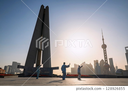 people exercise Tai Chi at People's and pearl tower at sunrise, Shanghai 128926855