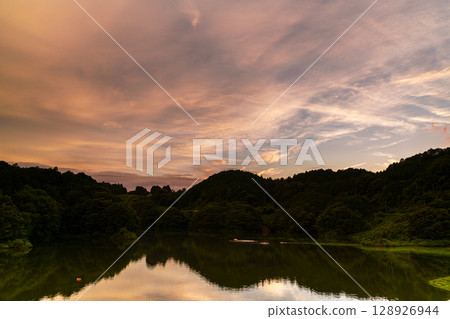 Summer 2025: Sunset covering the sky above Lake Nunome and its reflection on the lake surface② 128926944
