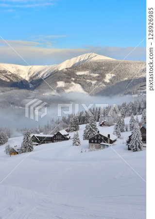 Snowy fairy tale with inverse fog in Giant mountains 128926985