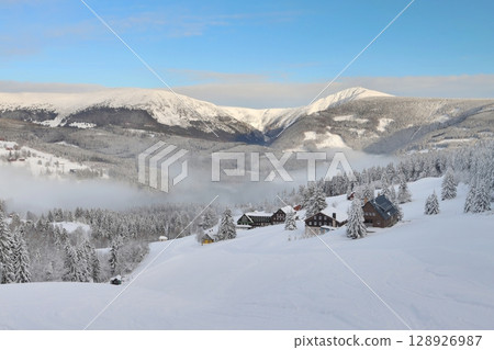 Snowy fairy tale with inverse fog in Giant mountains 128926987