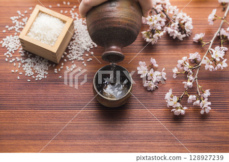 Sake and cherry blossoms Sake and cherry blossoms 128927239