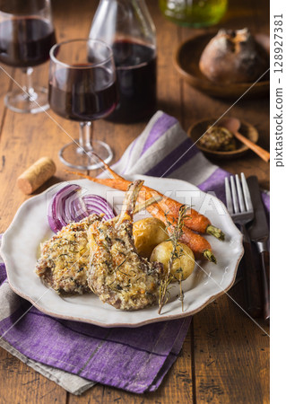 Herb-breaded lamb chops 128927381