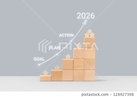 Business growth success achievement concept. Plan, goal and action to achieve success in 2026. Wooden blocks in form of graphical steps up of business growth process, sustainable financial plan. Business growth success achievement concept. Plan, goal and action to achieve success in 2026. Wooden blocks in form of graphical steps up of business growth process, sustainable financial plan. 128927398