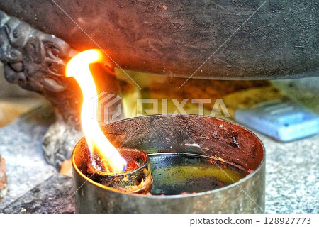 Flames flickering at shrines and temples Flames flickering at shrines and temples 128927773