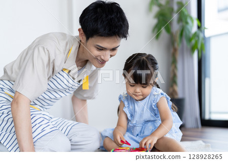 Child playing with father 128928265