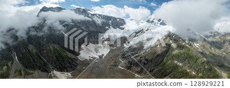 Panoramic view of summer landscape in the Swiss Alps with glacier 128929221