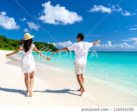 A couple having fun on a beautiful tropical beach 128930286