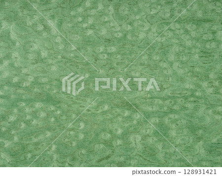 A tranquil sea of jade washes over this unique poplar burl veneer, with waves of verdant tones swirling in harmony 128931421