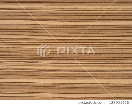 Zingana veneer surface with rich chocolate and caramel stripes in a natural linear pattern 128931426