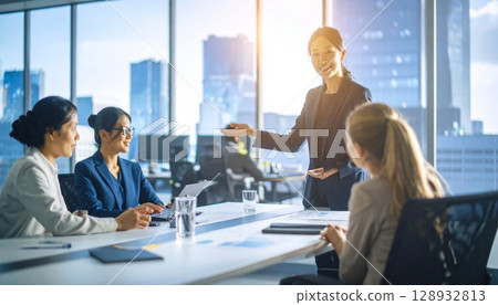 Female employee speaking at a meeting Female employee speaking at a meeting 128932813