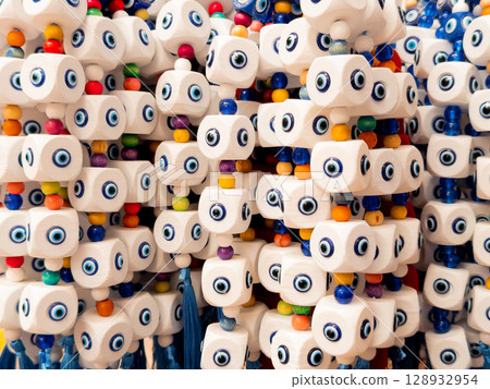 Colorful evil eye beads with white cubes and multicolored spheres for protection Colorful evil eye beads with white cubes and multicolored spheres for protection 128932954