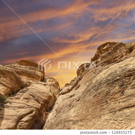 Mountains of Petra (against the background of a beautiful sky with clouds), Jordan, Middle East. Petra has been a UNESCO World Heritage Site since 1985 Mountains of Petra (against the background of a beautiful sky with clouds), Jordan, Middle East. Petra has been a UNESCO World Heritage Site since 1985 128933275