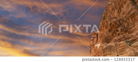 Mountains of Petra (against the background of a beautiful sky with clouds), Jordan, Middle East. Petra has been a UNESCO World Heritage Site since 1985 Mountains of Petra (against the background of a beautiful sky with clouds), Jordan, Middle East. Petra has been a UNESCO World Heritage Site since 1985 128933317