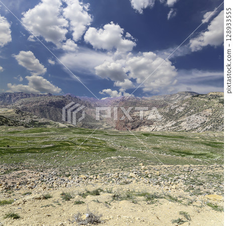 Typical mountain landscape, Jordan, Middle East  (photography from a high point). Against the background of a beautiful sky with clouds 128933555