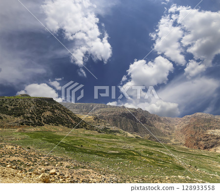 Typical mountain landscape, Jordan, Middle East  (photography from a high point). Against the background of a beautiful sky with clouds 128933558