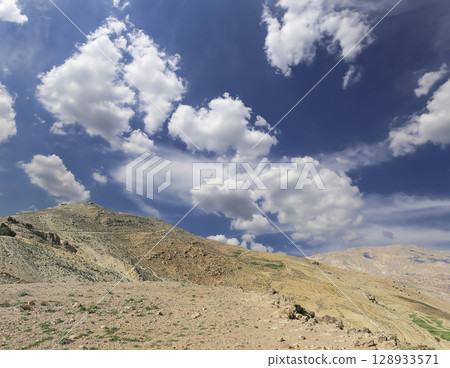 Typical mountain landscape, Jordan, Middle East  (photography from a high point). Against the background of a beautiful sky with clouds 128933571