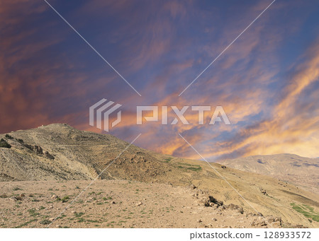 Typical mountain landscape, Jordan, Middle East  (photography from a high point). Against the background of a beautiful sky with clouds 128933572