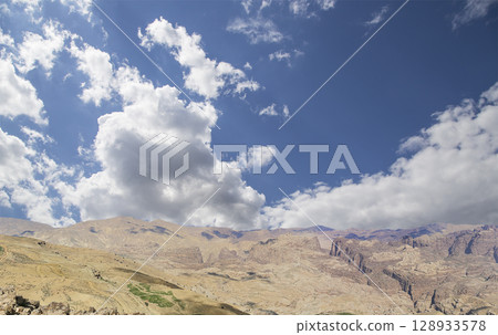 Typical mountain landscape, Jordan, Middle East  (photography from a high point). Against the background of a beautiful sky with clouds 128933578