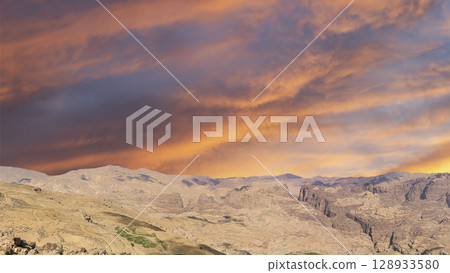 Typical mountain landscape, Jordan, Middle East (photography from a high point). Against the background of a beautiful sky with clouds Typical mountain landscape, Jordan, Middle East (photography from a high point). Against the background of a beautiful sky with clouds 128933580