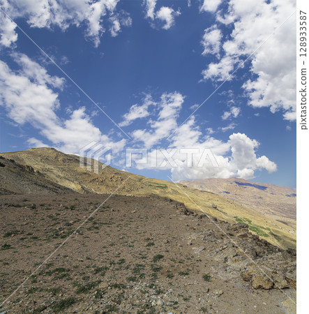 Typical mountain landscape, Jordan, Middle East  (photography from a high point). Against the background of a beautiful sky with clouds 128933587