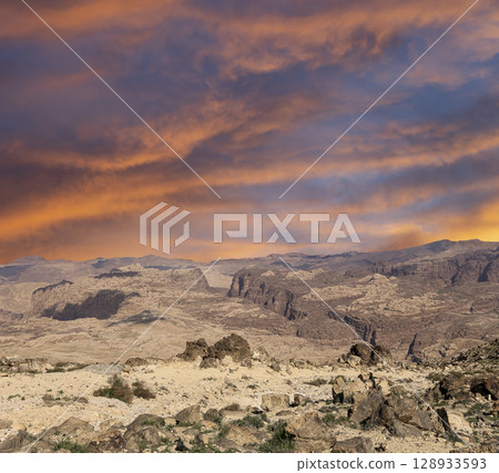 Typical mountain landscape, Jordan, Middle East (photography from a high point). Against the background of a beautiful sky with clouds Typical mountain landscape, Jordan, Middle East (photography from a high point). Against the background of a beautiful sky with clouds 128933593