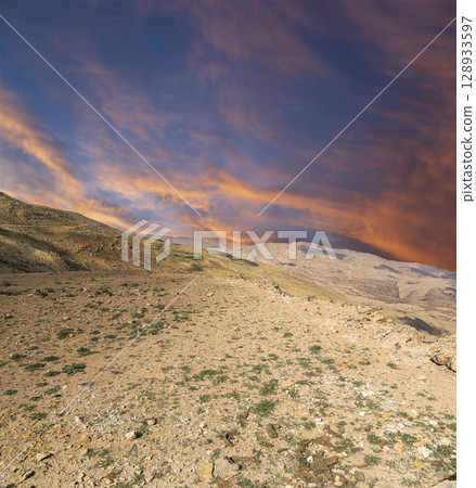 Typical mountain landscape, Jordan, Middle East  (photography from a high point). Against the background of a beautiful sky with clouds 128933597