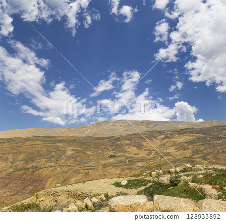 Typical mountain landscape, Jordan, Middle East  (photography from a high point). Against the background of a beautiful sky with clouds 128933892