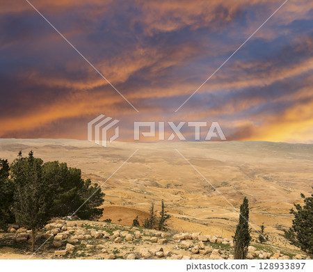 Typical mountain landscape, Jordan, Middle East  (photography from a high point). Against the background of a beautiful sky with clouds 128933897