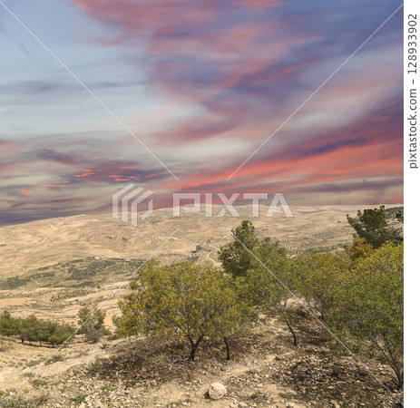 Typical mountain landscape, Jordan, Middle East  (photography from a high point). Against the background of a beautiful sky with clouds 128933902