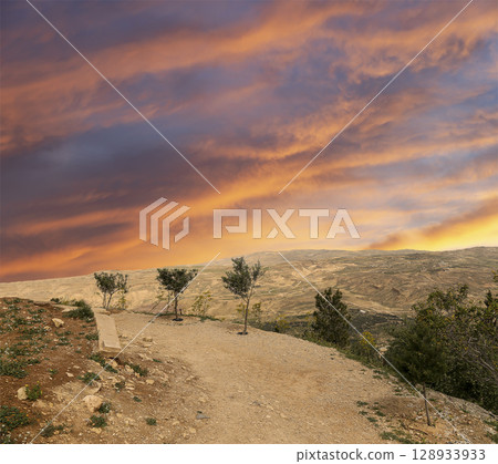 Typical mountain landscape, Jordan, Middle East (photography from a high point). Against the background of a beautiful sky with clouds Typical mountain landscape, Jordan, Middle East (photography from a high point). Against the background of a beautiful sky with clouds 128933933