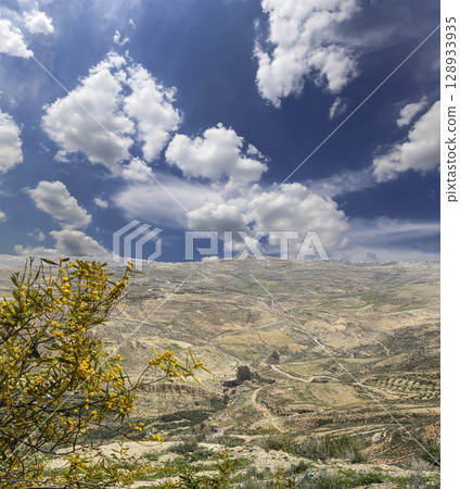Typical mountain landscape, Jordan, Middle East  (photography from a high point). Against the background of a beautiful sky with clouds 128933935