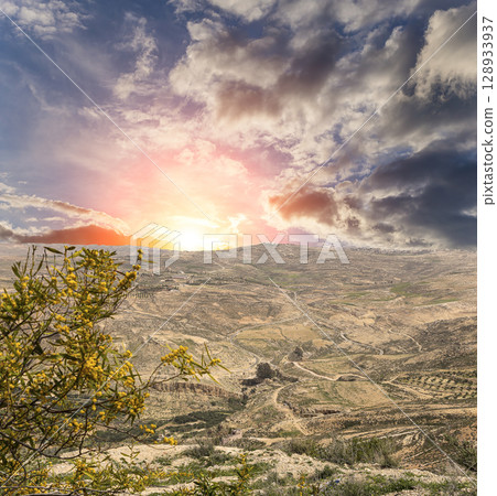 Typical mountain landscape, Jordan, Middle East  (photography from a high point). Against the background of a beautiful sky with clouds 128933937