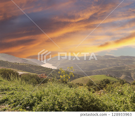Typical mountain landscape, Jordan, Middle East  (photography from a high point). Against the background of a beautiful sky with clouds 128933963