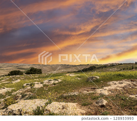 Typical mountain landscape, Jordan, Middle East (photography from a high point). Against the background of a beautiful sky with clouds Typical mountain landscape, Jordan, Middle East (photography from a high point). Against the background of a beautiful sky with clouds 128933993