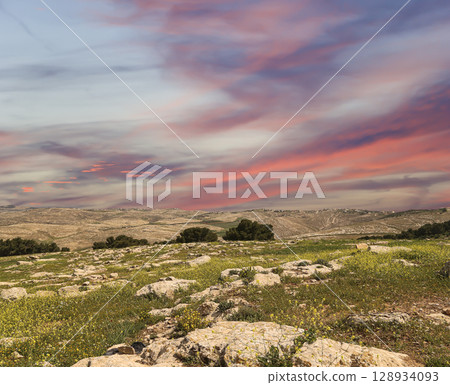 Typical mountain landscape, Jordan, Middle East (photography from a high point). Against the background of a beautiful sky with clouds Typical mountain landscape, Jordan, Middle East (photography from a high point). Against the background of a beautiful sky with clouds 128934093
