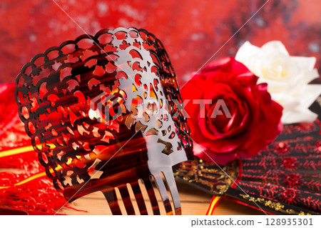 Flamenco comb fan and roses typical from Spain Espana 128935301