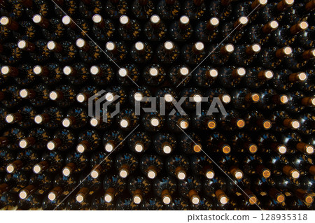 Wine bottles in a row as a pattern with cork 128935318