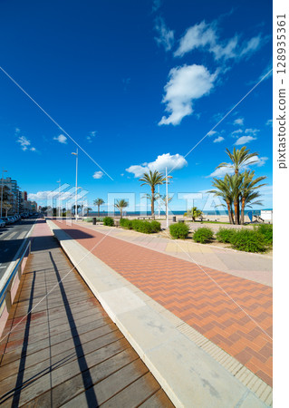 Gandia Beach sand in Mediterranean Sea of Spain 128935361