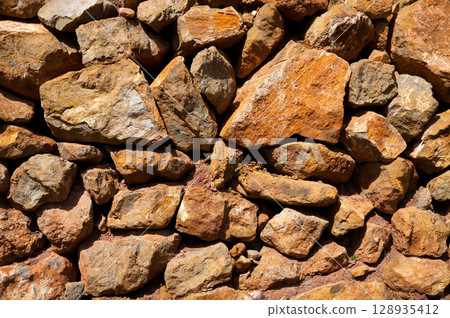 Masonry texture in Spain Mediterranean ancient wall 128935412