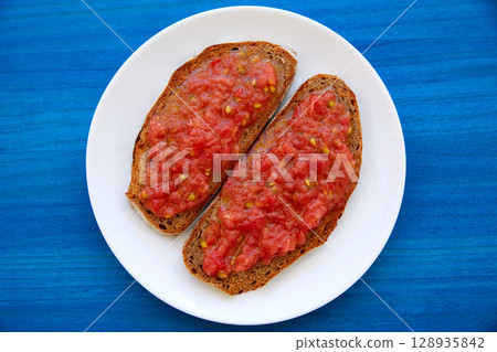Bread toasted slices with grated tomato Bread toasted slices with grated tomato 128935842