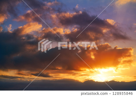 Sunset sky clouds orange and blue 128935846
