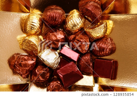 Golden chocolate box, holiday metaphor 128935854
