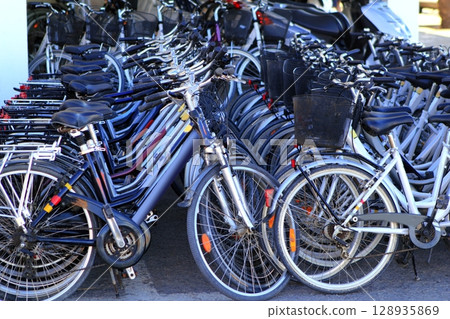 bicycles in a row many in a cycle rent store 128935869