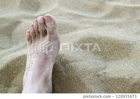 man foot in summer beach sand man foot in summer beach sand 128935873