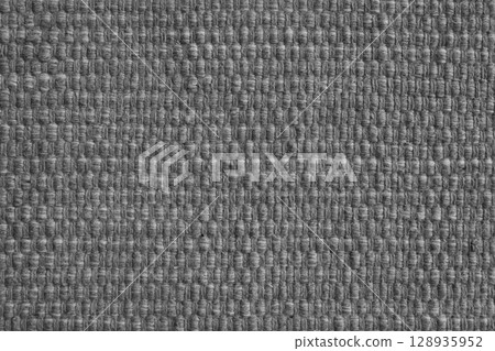 Texture of gray natural fabric with large weaving. Upholstery, cloth background Texture of gray natural fabric with large weaving. Upholstery, cloth background 128935952